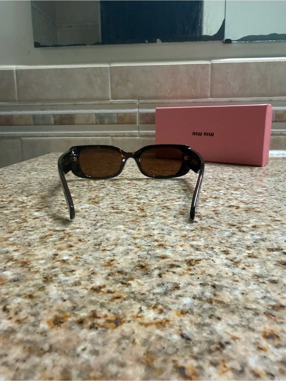 Miu Miu Tortoiseshell Sunglasses with Gold Temple Logo and Brown Lenses